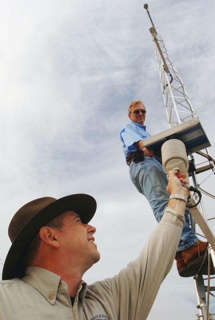 Lee Staudt, a field technician for the Florida Automated Weather Network, checks a monitoring station in Bronson, one of 33 University of Florida stations around the state that record freezing temperatures and other weather data for agricultural producers – Thursday, Dec. 22, 2005. Operated by UF’s Institute of Food and Agricultural Sciences, the network provides weather data that can be accessed by telephone or the FAWN Internet Web site: http://fawn.ifas.ufl.edu/.